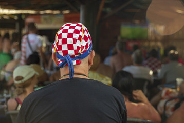 World Cup, old Croatian fan watching football on TV, Croatian football fan