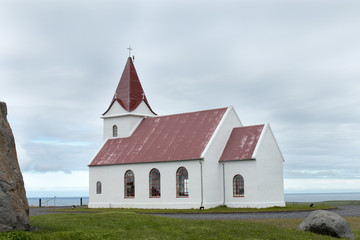 Fototapeta na wymiar Ingjaldshólskirkja red roof church near Hellissandur 