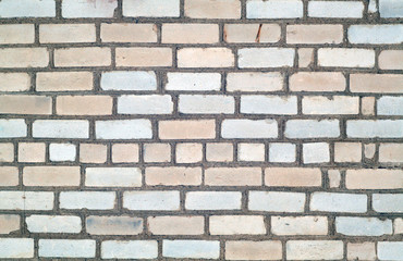 Grungy weahered brick wall.