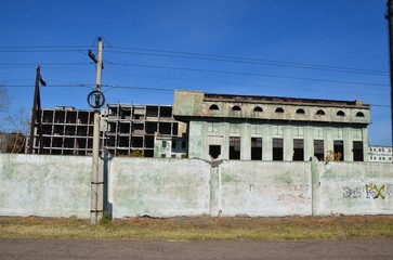 A frontal view of deserted foundry windows