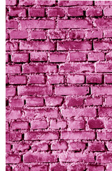 Old grungy brick wall surface in pink tone.