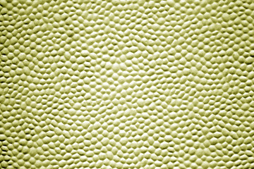 Metal texture with bubbles in yellow color.