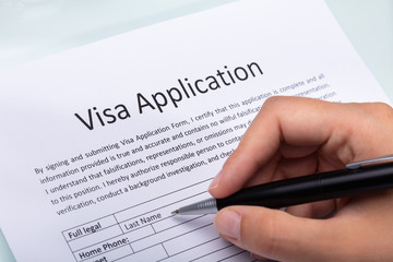 Woman Filling Visa Application Form