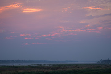 Mekong River, riverbank and beautiful colorful sky at sunset in Vientiane, Laos. Copy space.
