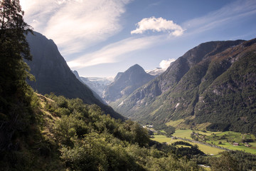 Amazing mountain landscape with colorful vivid sunset on the cloudy sky, natural outdoor travel background. Beauty world.