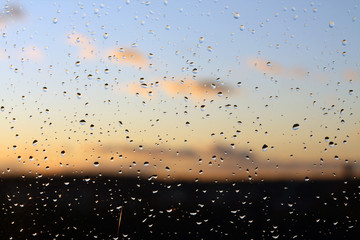 Rain drops and defocused sky background.