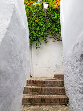 Fototapeta Narrow alley in Andalusian village