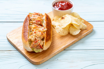 homemade lobster roll with potato chips