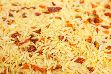 Background texture of basmati rice with dried vegetables