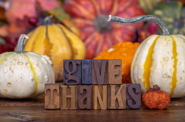 Give Thanks Text on a Colorful Background ao Autumn Squash