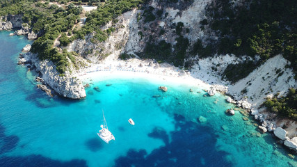 Aerial drone photo of iconic paradise sandy beach of Agiofili near port of Vasiliki with emerald crystal clear sea and sail boats docked, Lefkada island, Ionian, Greece