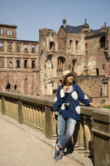 Fototapeta na wymiar Travelers thai woman travel visit and take photo at Heidelberg Castle in Baden-Wurttemberg, Germany