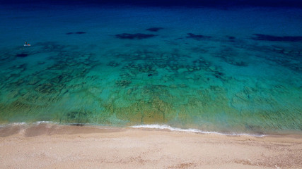 Fototapeta premium Aerial bird's eye view photo taken by drone of tropical white sandy beach with turquoise clear waters