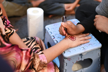 henna tattoo on bride's hand in her wedding night. asian culture and tradition concept