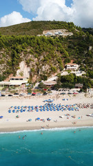 Aerial top view photo of sun beds in popular tropical paradise deep turquoise sandy beach of...