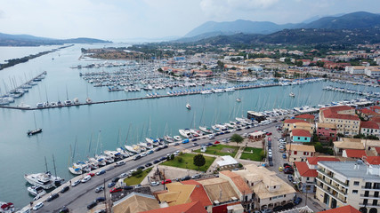 Naklejka premium Aerial drone bird's eye view photo from popular Marina full of yachts and sail boats in Lefkada city waterfront, Ionian, Greece