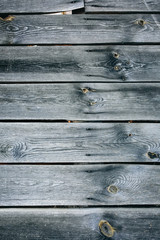 Old vintage wooden planks of the house. Grey wood texture background.