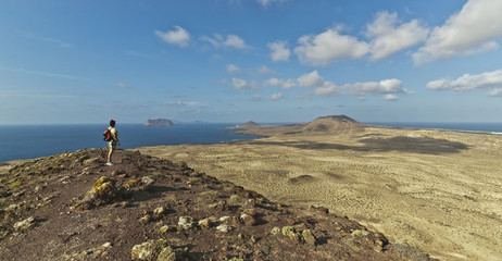 woman hiking on La Graciosa Island, the smallest of the Canary Islands