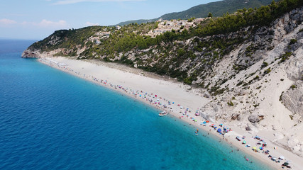 Aerial drone bird's eye view photo of small rocky beach next to iconic beach of Milos and Agios Nikitas in island of Lefkada, Ionian, Greece