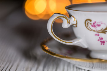 Tea Cup. Christmas decoration on defocused lights background