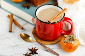 Autumn light still life with coffee and book
