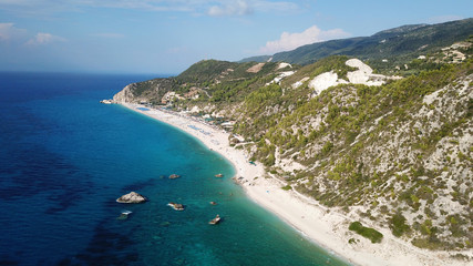 Fototapeta na wymiar Aerial drone bird's eye view photo of popular beach of Milos with turquoise clear waters and sun beds, island of Lefkada, Ionian, Greece