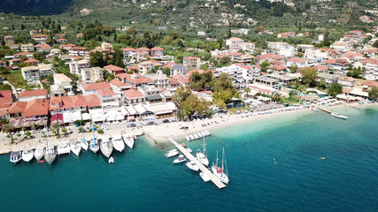 Naklejka na ściany i meble Aerial drone bird's eye view photo of iconic port of Nidri or Nydri a safe harbor for sail boats and famous for trips to Meganisi, Skorpios and other Ionian islands, Leflkada island, Ionian, Greece