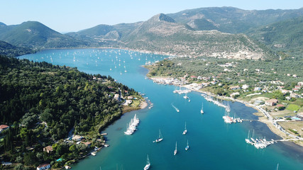Fototapeta na wymiar Aerial drone bird's eye view photo of iconic port of Nidri or Nydri a safe harbor for sail boats and famous for trips to Meganisi, Skorpios and other Ionian islands, Leflkada island, Ionian, Greece