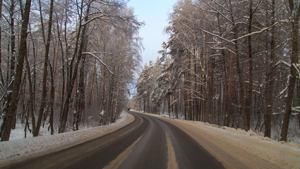 Fototapeta premium Snow road in the forest in winter