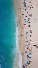 Fototapeta na wymiar Aerial drone photo of popular tropical paradise deep turquoise beach of Porto Katsiki with white steep rocky seascape and beautiful cloudy landscape, Lefkada island, Ionian, Greece