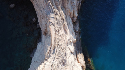 Aerial drone photo of popular tropical paradise deep turquoise beach of Porto Katsiki with white steep rocky seascape and beautiful cloudy landscape, Lefkada island, Ionian, Greece