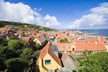 Fototapeta na wymiar Aerial view of small town - with beautiful, small houses - at the seaside, Gudhjem, Bornholm, Denmark