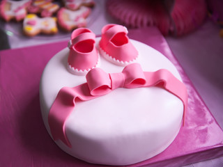 Beautiful children's pink cake for a newborn girl
