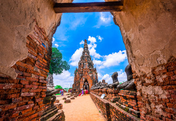 Tourists visit the ancient temple Wat Chaiwatthanaram located at Ayutthaya, Thailand. - obrazy, fototapety, plakaty