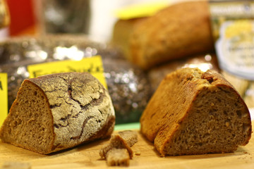 cut vegan bread on wooden kitchen board