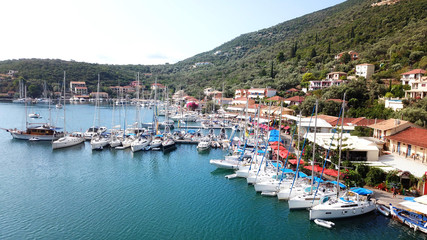 Fototapeta na wymiar Aerial drone photo of famous seaside village and bay of Sivota Lefkadas famous for trips to nearby beaches and dafe harbouring to sail boats, Lefkada, Greece