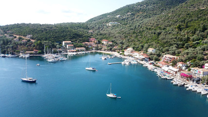 Fototapeta na wymiar Aerial drone photo of famous seaside village and bay of Sivota Lefkadas famous for trips to nearby beaches and dafe harbouring to sail boats, Lefkada, Greece