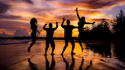 silhouette of people on the beach