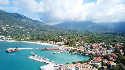 Fototapeta na wymiar Aerial drone photo of famous seaside village and port of Vasiliki famous for trips to Ionian islands and nearby beaches, Lefkada, Greece