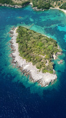 Aerial drone bird's eye view photo of famous sandy beach and small island of Agia Paraskevi with emerald clear sea, Thesprotia, Epirus, Greece