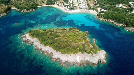 Aerial drone bird's eye view photo of famous sandy beach and small island of Agia Paraskevi with...