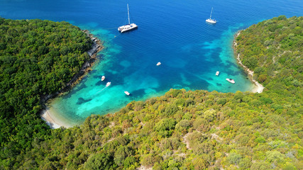 Aerial drone bird's eye view photo of iconic paradise sandy beach of blue lagoon with deep...
