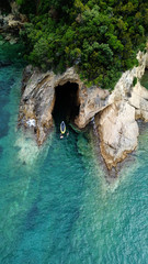 Aerial drone bird's eye view photo of famous caves in Sivota area, Epirus, Greece