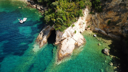 Aerial drone bird's eye view photo of famous caves in Sivota area, Epirus, Greece