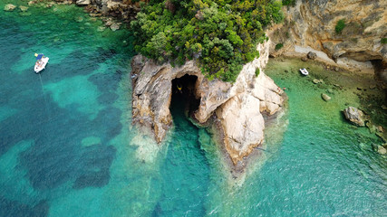 Aerial drone bird's eye view photo of famous caves in Sivota area, Epirus, Greece