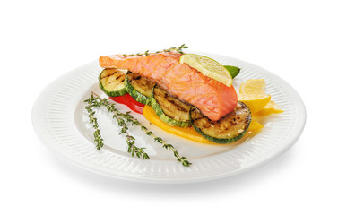 Plate with tasty salmon and fresh salad on white background