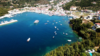 Aerial drone bird's eye view photo of famous village and port in bay of Sivota, Epirus, Greece