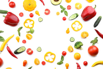 Frame made of various fresh vegetables on white background