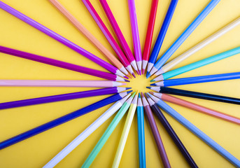 many colored pencils that form a circle