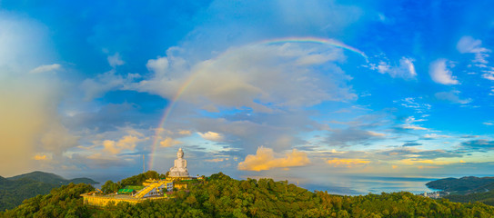 areial view amazing rainbow cover Phuket big Buddha..Phuket Big Buddha is one of the island most important and revered landmarks on the island. - obrazy, fototapety, plakaty